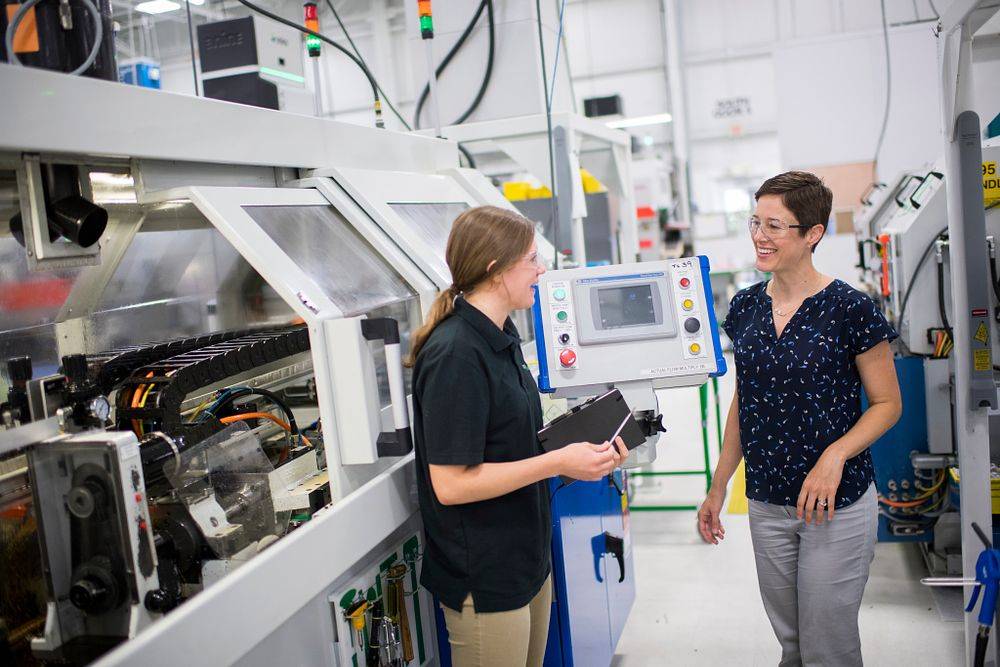 GVSU professor with student at an engineering co-op.